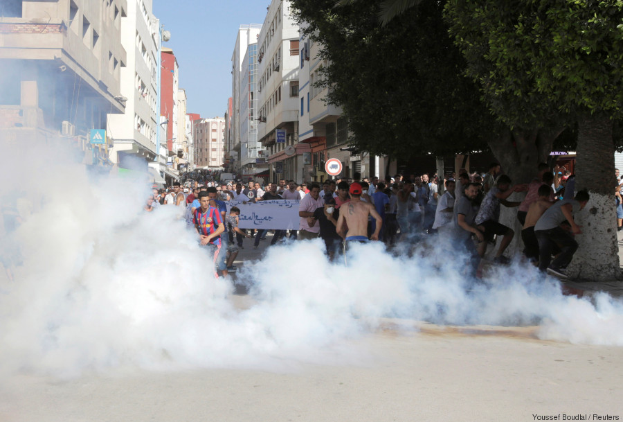 Police fire tear gas towards protesters during a demonstration against official abuses and corruption in the town of Al-Hoceima