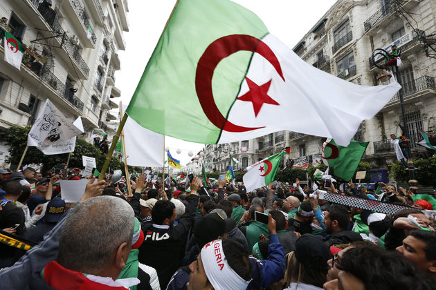 Thousands of demonstrators gather for a rally in Algiers, Friday April 5, 2019, chanting, singing and cheering after their movement forced out longtime President Abdelaziz Bouteflika - and demanding that other top figures leave too. Crowds massed Friday in Algiers boulevards and headed toward the central post office, symbol of the movement that has upended this energy-rich North African country. (AP Photo/Toufik Doudou)